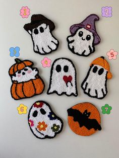 six embroidered halloween patches with ghost, pumpkins and witches on them in the shape of faces