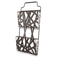 a metal rack with three compartments on the front and one in the back, hanging from a wall