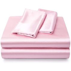 two sheets are folded on top of each other, one is pink and the other is white