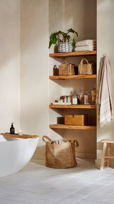 a bath room with a tub and shelves