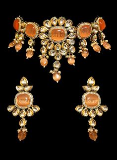 "Best Seller! Nayana - Modern Bride Kundan Bridal Set with Orange Onyx stone  Indian bridal set makes every bride's outfit perfect. This clear Kundan is further accented with orange Onyx gems making it one of a kind. Beautiful gemstone drops adorn this set.  This jewelry set is sure to make you stand out from the crowd. This necklace set comes along with a beautiful pair of Jhumka earrings with Kundan and Orange Onyx to match. Our Bridal collection is handmade with love & care. It makes us super Traditional Orange Gemstone Jewelry, Orange Temple Jewelry For Gifts, Orange Temple Jewelry As A Gift, Orange Temple Jewelry Gift, Elegant Orange Ceremonial Jewelry, Festive Orange Jewelry For Gift, Festive Orange Jewelry Gift, Traditional Orange Jewelry For Diwali, Orange Jewelry For Wedding And Diwali