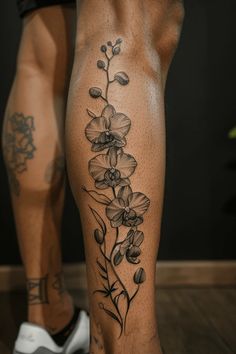 a woman's leg with flowers on it