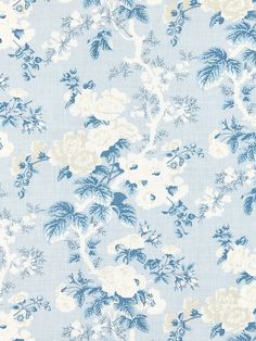 a blue and white wallpaper with flowers on it