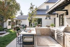 an outdoor kitchen and dining area is shown