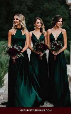 three bridesmaids in dark green dresses standing next to each other