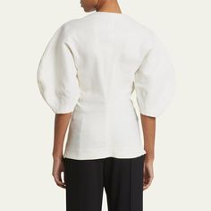 Proenza Schouler "Reagan" top in eco stretch linen-blend Crew neckline; concealed button front 3/4 puff sleeves Slim fit Linen/viscose/elastane Dry clean Made in Italy Fitted Cotton Blouse With Elastic Sleeves, Fitted Modern Top With 3/4 Sleeves, Fitted Blouse With Elastic Sleeves For Work, Versatile Fitted Puff Sleeve Blouse, Versatile Fitted Blouse With Puff Sleeves, Modern Half Sleeve Tops For Workwear, Modern Spring Tops With Structured Shoulders, Modern Tops With Structured Shoulders For Spring, Spring Tops With Structured Shoulders And Balloon Sleeves