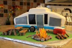 the camper cake is made to look like it's on fire