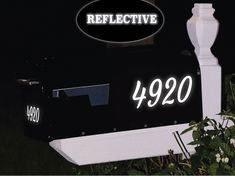 a black and white mailbox with the words reflective on it