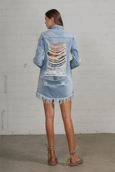 Heavy Body Destroyed Shirt Dress - Light Wash Denim Product Description: Upgrade your casual wardrobe with our Heavy Body Destroyed Shirt Dress, a statement piece designed to turn heads. This light wash denim dress features a heavily distressed look with shredded backing, adding a bold, edgy touch to your style. Crafted from 100% cotton, this dress combines durability with comfort, making it perfect for everyday wear. The collared neck and long sleeves provide a classic silhouette, while the abo Light Wash Denim Dress With Frayed Hem For Fall, Fall Light Wash Denim Dress With Frayed Hem, Spring Distressed Denim Dress, Distressed Medium Wash Denim Dress For Summer, Summer Distressed Cotton Denim Dress, Summer Distressed Medium Wash Denim Dress, Spring Distressed Cotton Denim Dress, Summer Distressed Denim Dress, Distressed Denim Blue Dress For Summer