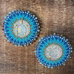 Native American made flat-stitch beadwork, size 11 cut beads, Large 2.25 x 2.25 stud earrings, backed with tanned leather Artisan Blue Beaded Round Earrings, Artisan Blue Beaded Earrings, Handmade Artisan Blue Beaded Earrings, Handmade Blue Round Clip-on Earrings, Handmade Blue Bohemian Clip-on Earrings, Artisan Bead Cap Earrings, Artisan Blue Round Beaded Earrings, Blue Round Beaded Earrings With Spacer Beads, Blue Beaded Clip-on Earrings Gift