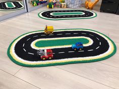 a child's play area with cars and trucks