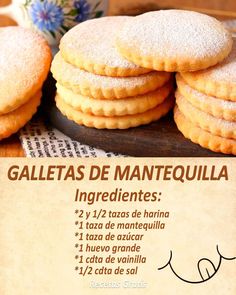 some cookies are stacked on top of each other in front of a sign that says galletas de mantequila