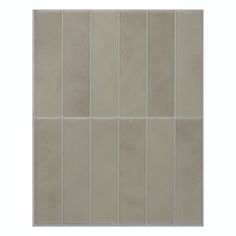 a white tile wall with vertical lines on it