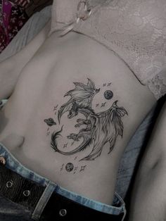 a woman with a tattoo on her stomach