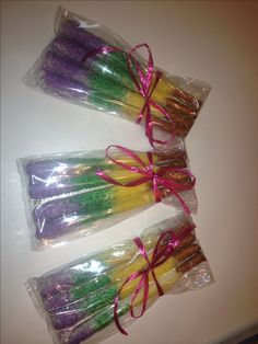 three bags filled with different colored candy sticks