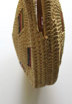 Here we have a cute Vintage Large Round Straw Raffia Tote Handbag from the 1970s. It has two straw handles and it is made of woven raffia. It has green, red and yellow raffia accents. The bag measures 14 inches in diameter, 17 inches tall including the handle and 2 1/2 inches thick around the edges. It is in fantastic shape minus some wear on the bottom. This awesome purse would make a great addition to any outfit! Red Woven Beach Bag In Basket Shape, Red Woven Basket Beach Bag, Vintage Red Shoulder Bag For Summer, Vintage Brown Woven Straw Bag, Vintage Handwoven Beige Straw Bag, Retro Natural Shoulder Bag For Beach, Retro Natural Shoulder Bag For The Beach, Vintage Handmade Straw Beach Bag, Vintage Rectangular Straw Bag With Handles