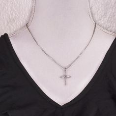 This cross pendant has multi shapes of high quality cubic zirconia crystals clustered on a cross. The cross is hanging on fancy flat curve chain that is in 18k Gold plated or white gold plated. Great to layer with other necklace or it could be worn itself to show your beautiful faith.Find more cross necklaces on my shops.Material - Cubic Zirconia & 14k gold plated and silver plated on brass. Color: Gold / SilverLength: 16" + 3" Inches Extender ChainCharms Total Length: 20*25 mm ＦＩＮＤ ＵＳ__________ White Gold Cross Necklace With Clavicle Chain, White Gold Cross Necklace With Adjustable Chain, White Gold Crucifix Necklace With Cubic Zirconia, White Gold Cubic Zirconia Crucifix Necklace, Cubic Zirconia Cross Necklace With Clavicle Chain, Silver Cubic Zirconia Crucifix Necklace, Silver Crucifix Necklace In Cubic Zirconia, Silver Crucifix Necklace With Cubic Zirconia, Cross Charm Necklace