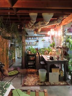 a room filled with lots of plants and furniture