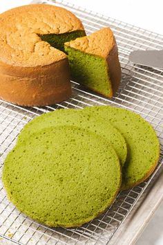 two cakes on a cooling rack with one cut in half