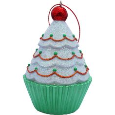 a christmas cupcake ornament is shown on a white background