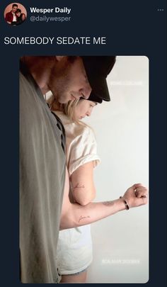 a man and woman with tattoos on their arms