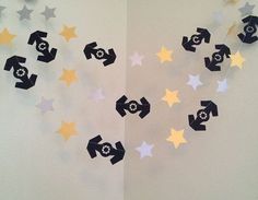 the wall is decorated with black and yellow stars, which are cut out from paper