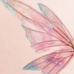 a pink and blue butterfly flying through the air with stars on it's wings