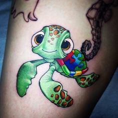 a small turtle tattoo on the leg