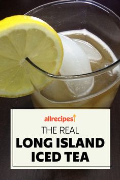 the real long island iced tea is in a glass with ice and lemon wedges