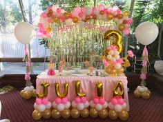 a birthday party with balloons and decorations