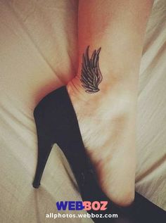 a woman's foot with a small wing tattoo on her left ankle and black high heels