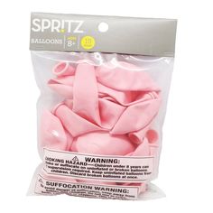 a bag of pink cottons sitting on top of a white table