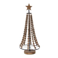 a christmas tree made out of wood beads with a star on top and an iron stand