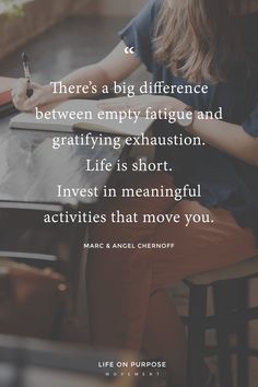 a woman sitting at a table writing on a piece of paper with the words, there's a big difference between empty fatigue and grafifying exhaustion life is short invest in meaning