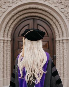 a woman with long blonde hair wearing a graduation cap and gown