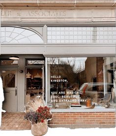 a store front with an assortment of items in the window