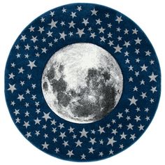 a blue and white plate with stars on it that has a full moon in the center