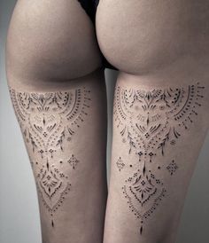 the back of a woman's thigh with tattoos on her legs and butts