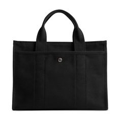 Detailed with cursive Coach script embroidery and iconic turnlock closure, this spacious Cargo tote has an open interior with room for a 13' laptop, two outside pockets for easy organization, and a removable webbing strap for shoulder or crossbody wear..Medium sized bag; 13-1/2'W x 10'H x 6-1/4'D (width is measured across the bottom of handbag).Silhouette is based off 5'9' model.4-1/2' straps; 24' removable strap.Zip closure.Silver-tone hardware, exterior turn-lock & snap pockets.Laptop compatible (std. size 13'-15').Cotton, polyester, leather.Spot clean Coach Everyday Rectangular Briefcase, Coach Canvas Shoulder Bag For Everyday, Everyday Coach Rectangular Briefcase, Coach Canvas Shoulder Bag, Coach Travel Bag In Canvas, Coach Canvas Travel Bag, Daily Use Coach Canvas Bags, Coach Briefcase Satchel For Everyday Use, Coach Briefcase For Everyday Use