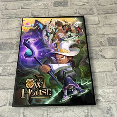 the dvd cover for disney's the owl house is displayed on a brick wall