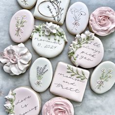 decorated cookies with names and flowers on them