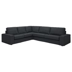 a black sectional couch sitting on top of a white floor