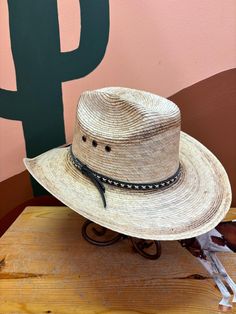 Head out on adventures in the West Texas, a Mexican Palm straw cowboy hat that will look adorable on your littlest buckaroos while making them feel like a grown-up cowboy. Structured in a classic western style, the West Texas has a faux leather hat band with cream stitching. Fitted with an elastic sweatband for a comfortable wear. Lil Pardner Collection Elastic Sweatband Grown Up Style Material: Palm Leaf Brim: 2 3/4" Adjustable Rodeo Hat With Single Vent, Adjustable Hats With Single Vent For Rodeo, Western Brimmed Hat With Adjustable Fit, Adjustable Hat With Single Vent For Rodeo, Western Style Brimmed Hat With Adjustable Fit, Southwestern Fedora For Summer Western-themed Events, Southwestern Style Fedora For Western-themed Summer Events, Southwestern Style Fedora For Summer Western Events, Southwestern Style Summer Fedora For Western-themed Events