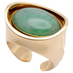 Ring size: 7 Introducing a truly stunning vintage jade cocktail ring, a masterpiece of fine craftsmanship and undeniable elegance. This alluring ring, crafted by esteemed designer Bent Knudsen, showcases a captivating oval cabochon jade gemstone in a unique yellow gold concave design. At the heart of this remarkable ring lies a mesmerizing jade stone, renowned for its luscious green hue and inherent tranquility. The smooth and polished surface of the jade emits a serene aura, while the wide, hor Yellow Gold Cocktail Ring, Jade Gemstone, Gold Cocktail Ring, Gold Cocktail, Jade Stone, Trendy Jewelry, Belleza Natural, Oval Cabochon, Ring Size 7