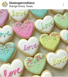 heart shaped cookies with love written on them