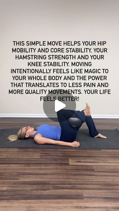 a woman laying on the floor with her arms up and legs down in yoga position