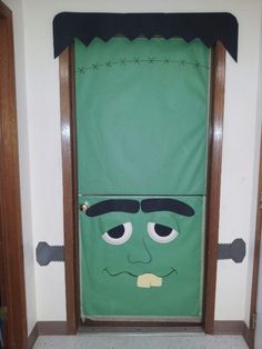 a door decorated with a green monster face