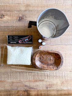 the ingredients to make an ice cream cake are shown on a wooden surface, including sugar and vanilla