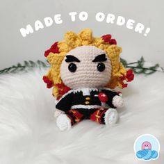 a small crocheted doll sitting on top of a white fur covered floor with the words made to order written above it