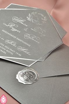 a close up of an envelope with a wax stamp on the front and back of it